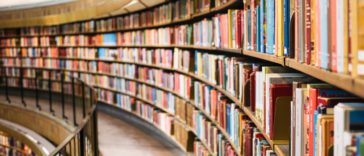 books on brown wooden shelf