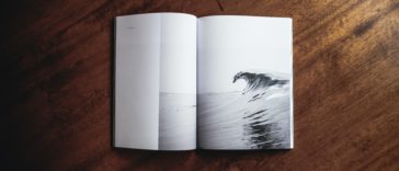 book opened on brown wooden table